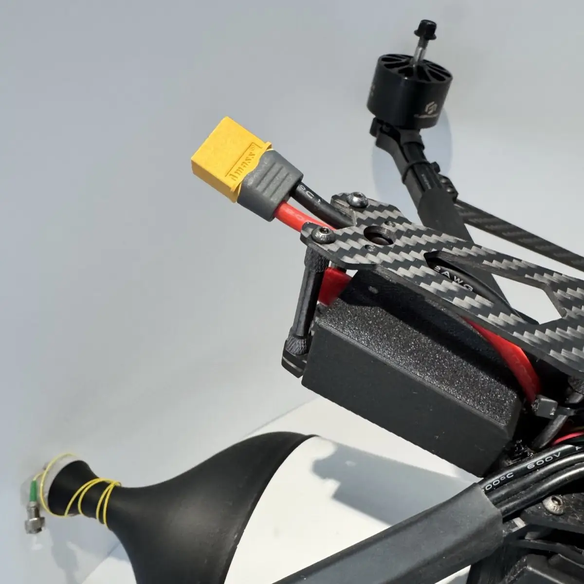UAV frame detail — motor, carbon arm and XT60 power connector
